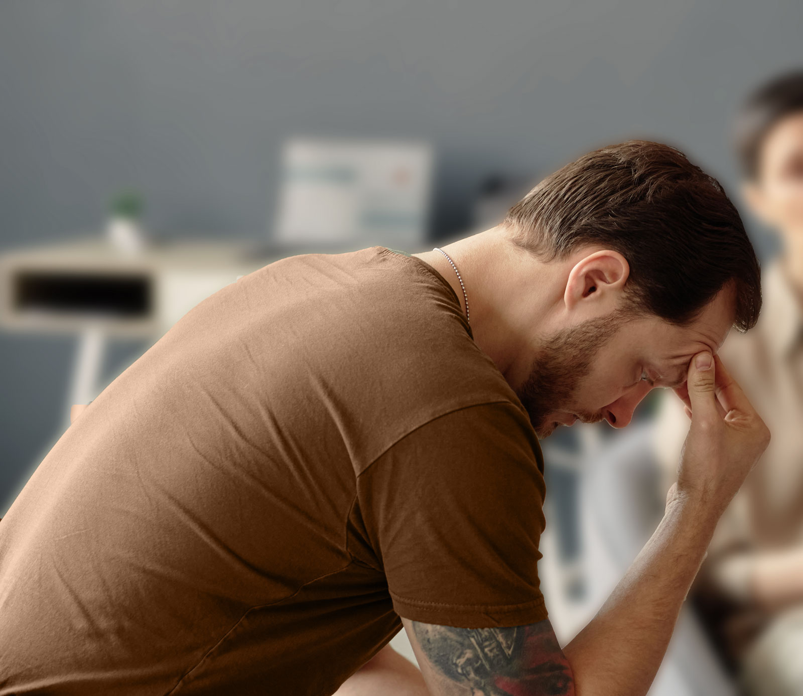 depressed-man-resting-head-hands